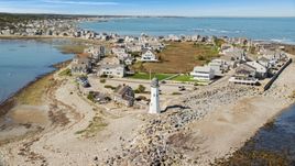A beach, oceanfront homes, and Old Scituate Light, Scituate, Massachusetts Aerial Stock Photos | AX143_041.0000204
