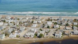 A group of oceanfront homes near ocean waves crashing, Humarock, Massachusetts Aerial Stock Photos | AX143_053.0000266