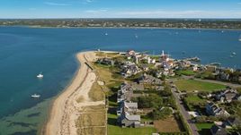 Oceanfront homes and Nantucket Harbor Lights, Nantucket, Massachusetts Aerial Stock Photos | AX144_088.0000000