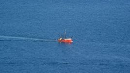 A fishing boat sailing on the Atlantic Ocean Aerial Stock Photos | AX144_181.0000000