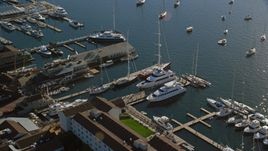 Yachts and sailboats docked at piers in Newport, Rhode Island Aerial Stock Photos | AX144_238.0000000