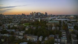 Dorchester Heights Monument in South Boston at twilight and the Downtown Boston skyline, Massachusetts Aerial Stock Photos | AX146_120.0000325F