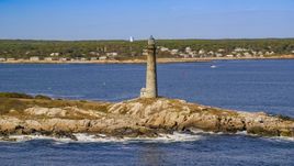 A lighthouse on Thatcher Island, Massachusetts Aerial Stock Photos | AX147_112.0000000