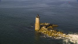 A lighthouse in the water by rocky shore, Kittery, Maine Aerial Stock Photos | AX147_196.0000000