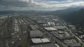 Warehouses and train yard in an industrial area, Northwest Portland, Oregon Aerial Stock Photos | AX153_063.0000297F