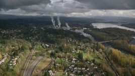 High above Highway 14 looking out toward a paper mill in Camas, Washington Aerial Stock Photos | AX153_149.0000054F