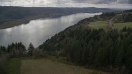 Columbia River Gorge seen from tree covered cliff, Washington Aerial Stock Photos | AX153_188.0000183F