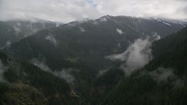 A misty canyon and a mountain ridge with light snow in Cascade Range, Hood River County, Oregon Aerial Stock Photos | AX154_052.0000243F