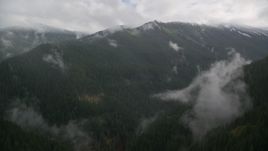 A mountain ridge with light snow at the end of a misty canyon in Cascade Range, Hood River County, Oregon Aerial Stock Photos | AX154_052.0000388F