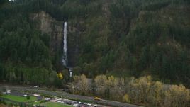 I-84 highway by Multnomah Falls on a cliff face of the Columbia River Gorge Aerial Stock Photos | AX154_189.0000297F
