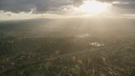 Godrays shining down on suburban neighborhoods and Highway 26, Southwest Portland, Oregon Aerial Stock Photos | AX155_119.0000265F