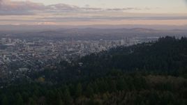 Mount Hood and Downtown Portland at sunset, seen from evergreen forest and hills in Northwest Portland, Oregon Aerial Stock Photos | AX155_140.0000337F