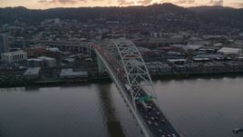 Heavy traffic crossing the Fremont Bridge at sunset in Downtown Portland, Oregon Aerial Stock Photos | AX155_158.0000229F