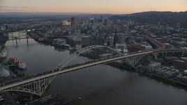 Heavy traffic on the Fremont Bridge at sunset, Downtown Portland in the background, Oregon Aerial Stock Photos | AX155_161.0000000F