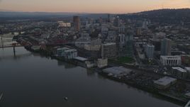 Skyscrapers and buildings along the river at sunset, Downtown Portland, Oregon Aerial Stock Photos | AX155_183.0000300F