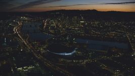 Downtown Portland and Willamette River at night seen from Moda Center in Oregon Aerial Stock Photos | AX155_308.0000296F
