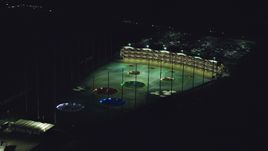 A warehouse building and a Topgolf course in Hillsboro, Oregon at night Aerial Stock Photos | AX155_475.0000259F