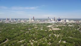 Midtown and Downtown Atlanta seen from above the trees in West Atlanta, Georgia Aerial Stock Photos | AX37_006.0000258F