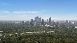 Distant shot of Midtown Atlanta skyscrapers beyond trees, Buckhead, Georgia Aerial Stock Photos | AX38_027.0000048F
