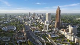 Downtown Connector along city buildings; Midtown Atlanta, Georgia, sunset Aerial Stock Photos | AX39_049.0000050F