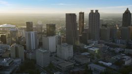 Downtown Atlanta skyscrapers at sunset with hazy skies, Georgia Aerial Stock Photos | AX39_066.0000060F