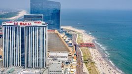 Trump Taj Mahal by the boardwalk and beach in Atlantic City, New Jersey Aerial Stock Photos | AXP071_000_0018F