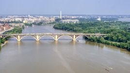 Francis Scott Key Bridge over the Potomac River, Washington Monument in background in Washington DC Aerial Stock Photos | AXP075_000_0017F