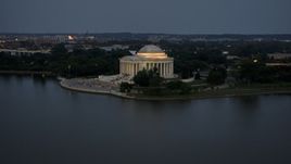 The Jefferson Memorial lit up for evening, Washington, D.C., twilight Aerial Stock Photos | AXP076_000_0034F