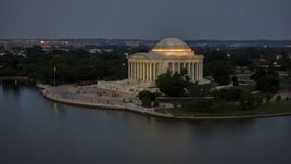 The Jefferson Memorial lit up at twilight in Washington, D.C. Aerial Stock Photos | AXP076_000_0035F