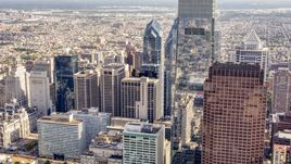 Comcast Center towering over Downtown Philadelphia skyscrapers, Pennsylvania Aerial Stock Photos | AXP079_000_0004F
