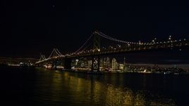 The Bay Bridge in front of the Downtown San Francisco skyline, California, night Aerial Stock Photos | DCSF06_002.0000085
