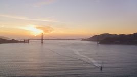 Setting sun behind the Golden Gate Bridge, San Francisco, California, sunset Aerial Stock Photos | DCSF10_025.0000033