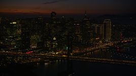 Heavy traffic on the Bay Bridge by Downtown San Francisco skyscrapers, California, night Aerial Stock Photos | DCSF10_071.0000539