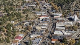 Shops lining a road through Estes Park, Colorado Aerial Stock Photos | DXP001_000223