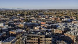A view across the tops of brick office buildings and small shops in Fort Collins, Colorado Aerial Stock Photos | DXP001_000247