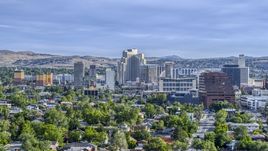 High-rise casino resorts and office buildings seen from neighborhoods in Reno, Nevada Aerial Stock Photos | DXP001_006_0013