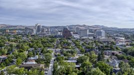 A wide view of high-rise casino resorts and office buildings seen from a neighborhood in Reno, Nevada Aerial Stock Photos | DXP001_006_0014