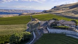 The Maryhill Winery and surrounding vineyard seen from the amphitheater in Goldendale, Washington Aerial Stock Photos | DXP001_019_0019