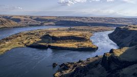 A view of Miller Island and the Columbia River seen from steep cliffs in Goldendale, Washington Aerial Stock Photos | DXP001_019_0024
