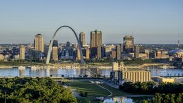 A grain elevator and park with a view of the Arch and skyline across the Mississippi River, sunrise, Downtown St. Louis, Missouri Aerial Stock Photos | DXP001_021_0006