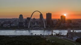 Gateway Arch and Downtown St. Louis, Missouri skyline with the setting sun in the background Aerial Stock Photos | DXP001_029_0006