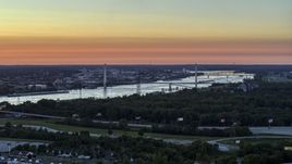 The Stan Musial Veterans Memorial Bridge and Mississippi River at sunset in St. Louis, Missouri Aerial Stock Photos | DXP001_029_0009