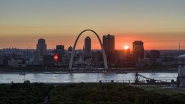 Famous Gateway Arch and the Downtown St. Louis, Missouri skyline in silhouette at sunset Aerial Stock Photos | DXP001_029_0011