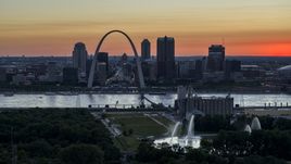 Gateway Arch across the river, seen from grain elevator and fountains, Downtown St. Louis, Missouri, twilight Aerial Stock Photos | DXP001_029_0013