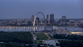 The Gateway Arch at twilight, visible from across the Mississippi River, Downtown St. Louis, Missouri Aerial Stock Photos | DXP001_037_0001