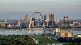 A view of the St. Louis Arch and the city skyline at sunrise in Downtown St. Louis, Missouri Aerial Stock Photos | DXP001_038_0007