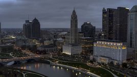 A view of LeVeque Tower across the river at twilight, Downtown Columbus, Ohio Aerial Stock Photos | DXP001_087_0012