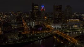 The city skyline, and bridge spanning the river at night, Downtown Columbus, Ohio Aerial Stock Photos | DXP001_088_0013