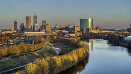 The city's skyline at sunset seen from White River, Downtown Indianapolis, Indiana Aerial Stock Photos | DXP001_092_0007