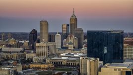 A hotel at sunset, city skyline in the background in Downtown Indianapolis, Indiana Aerial Stock Photos | DXP001_092_0019